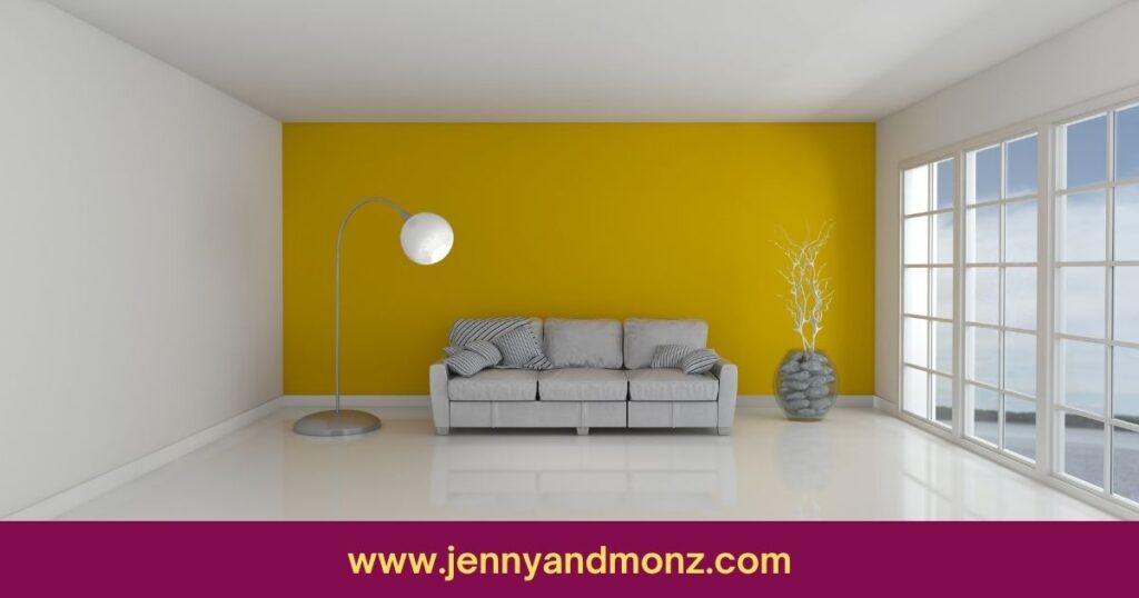 glossy yellow wall with grey sofa in a living room