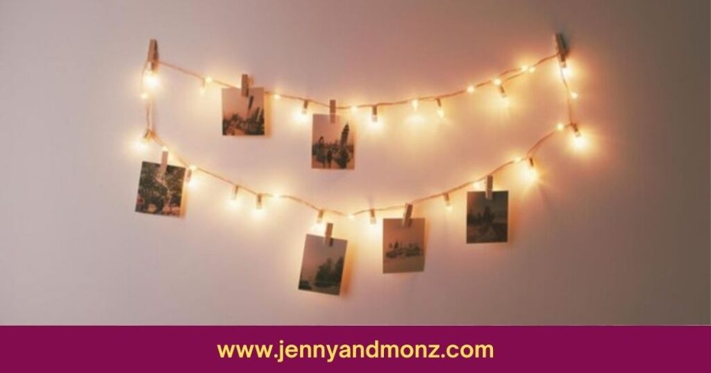 string of lights with pictures hanging on wall