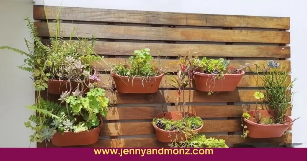 vertical garden on patio wall with vases and pallets attached